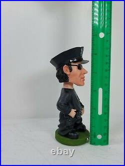 Vintage NYPD Bobble Head Looks Like Nicolas Cage