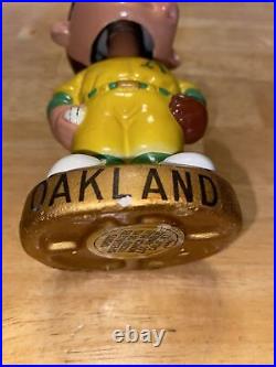 Vintage Oakland A's Bobble head gold base great condition